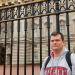 Standing in front of Buckingham Palace, London, England