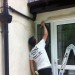 Me painting the outside of a house