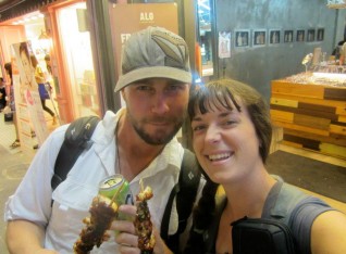 Mark and Kylee eating street meat in Seoul, South Korea 2011