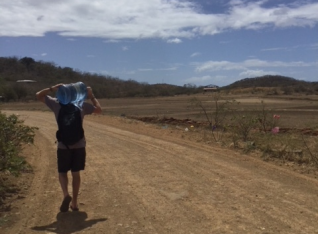 Mark carrying water home