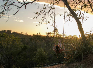 Kylee on the swing in the sunset