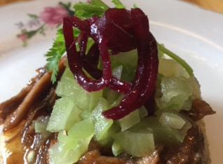 Pork ribs with green tomato and Cabbage slaw